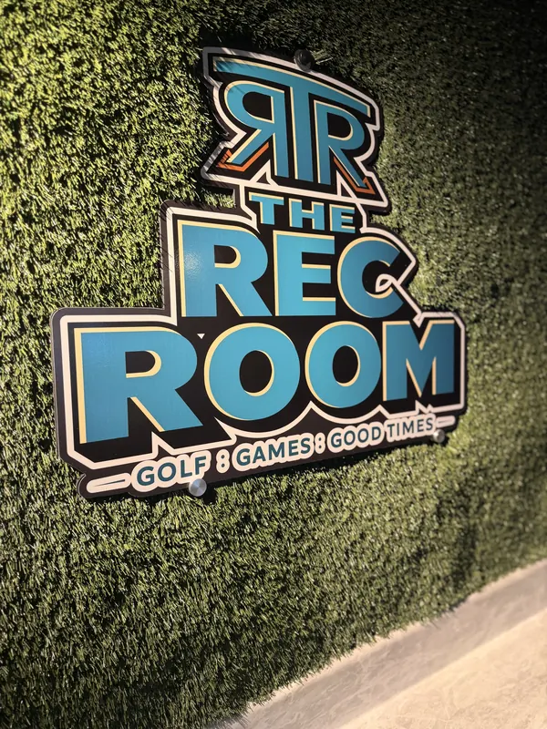 The Rec Room sign on the turf wall.